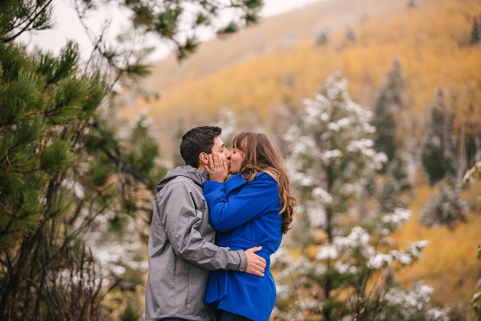 Couple kissing in the mountains near Ski Santa Fe