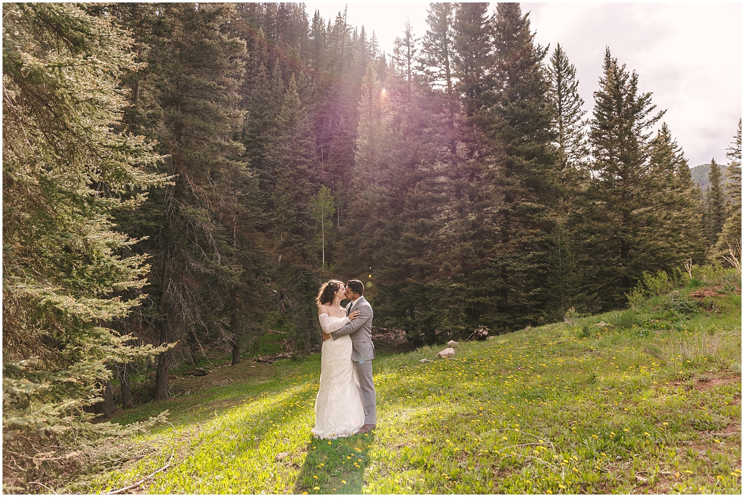Bride and groom kiss for golden hour portraits at Telluride wedding