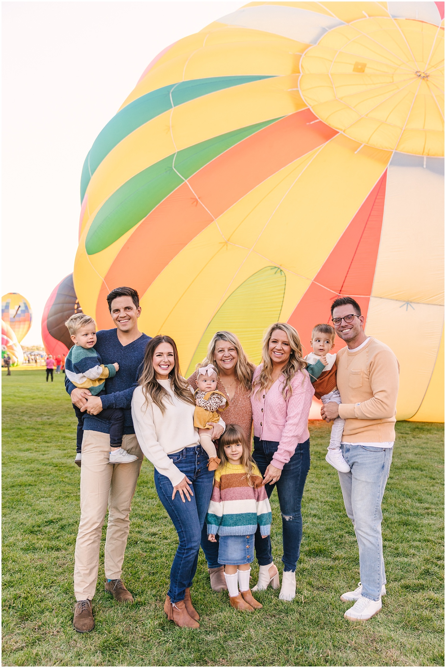 Professional family photography at the Albuquerque International Balloon Fiesta park during evening glow